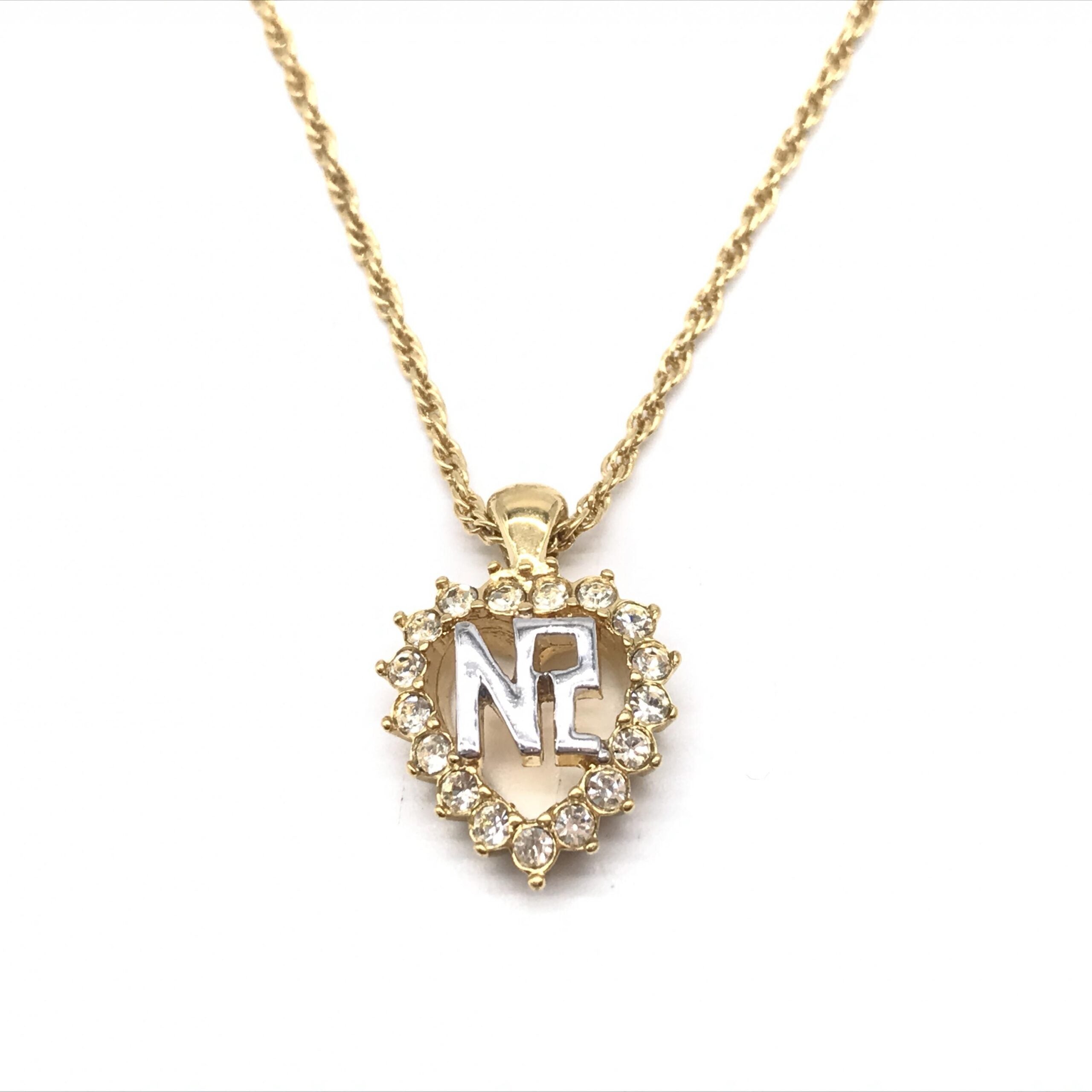 Nina Ricci Gold Tone Pendant Necklace With Heart Design
