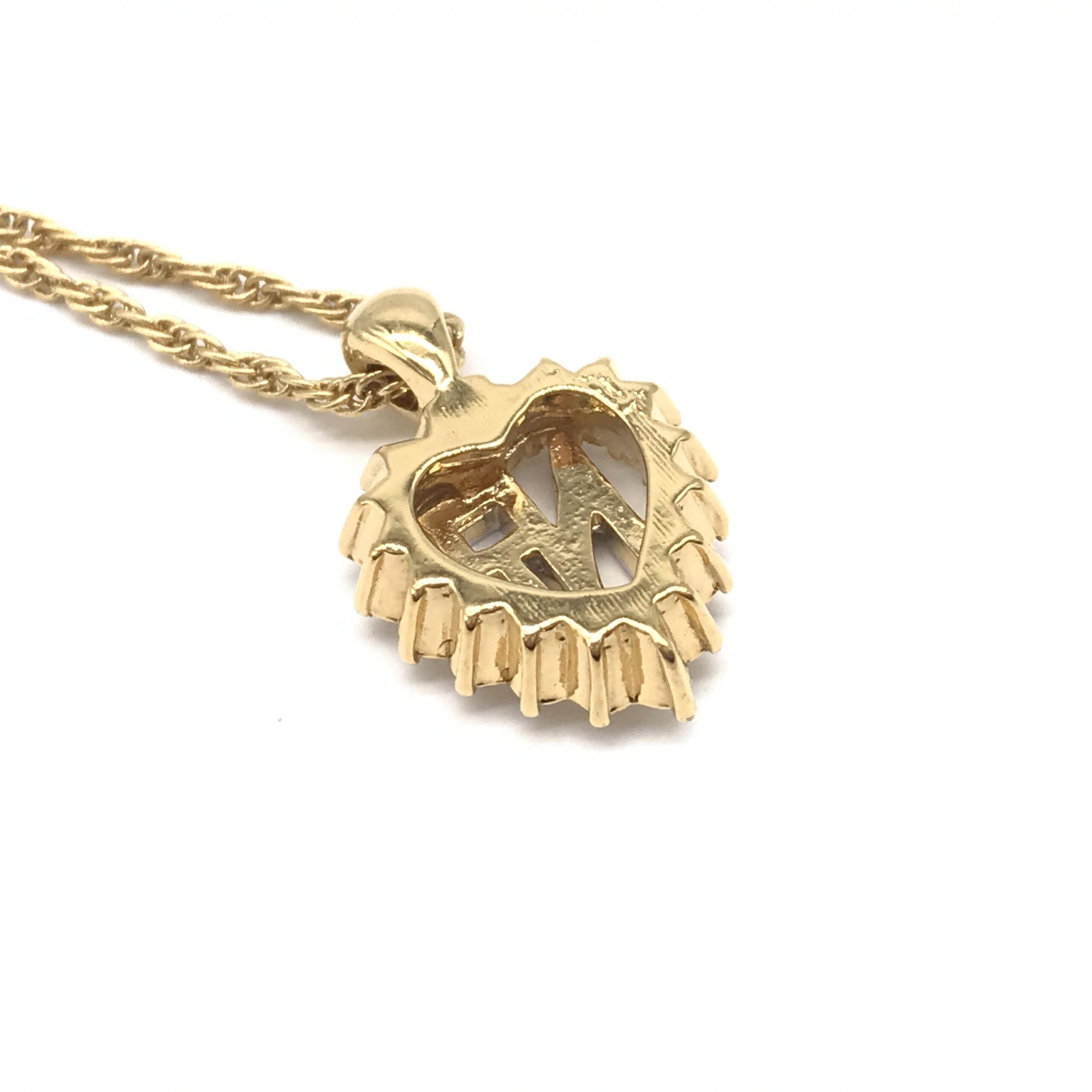 Nina Ricci Gold Tone Pendant Necklace With Heart Design