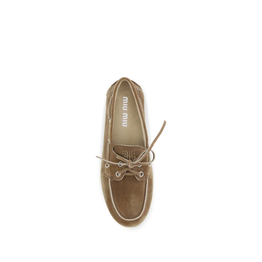 Miu Miu Beige Calf Leather Bos Taurus Slip-On Loafers - Luxe Nova